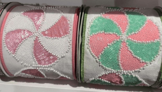 Two rolls of pink and green sequined peppermint ribbon for wreath