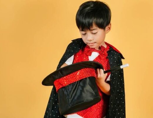 Young boy holding a black bag,
