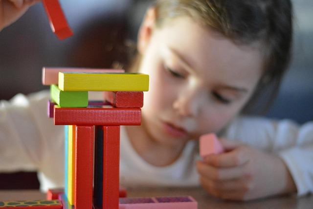 Kid playing build with toys