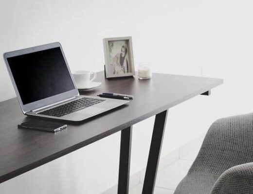 Laptop on wooden desk for work from home setup