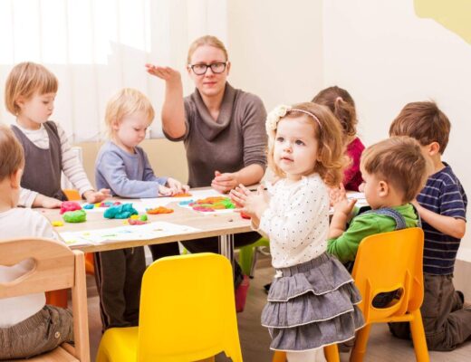 Preschool children learning together at a wooden table