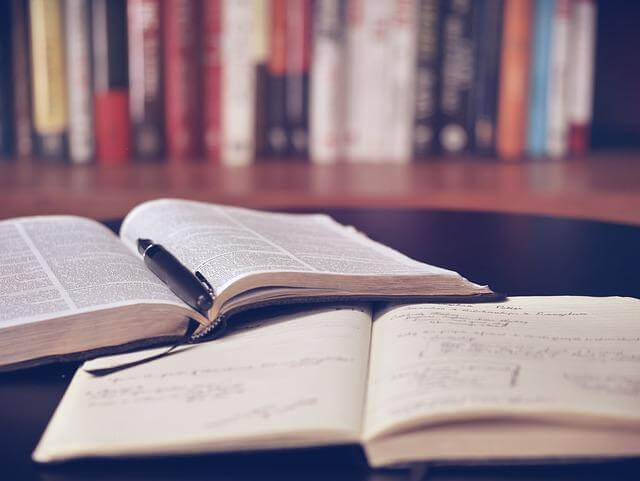 Two open books on a table near a