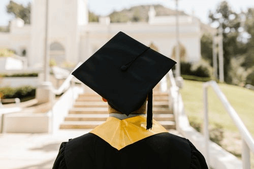 Student in graduation cap and gown,