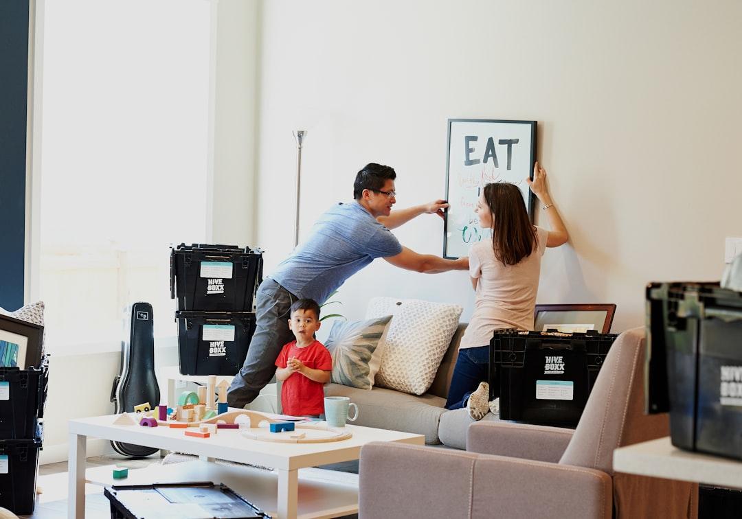 A family packing moving boxes at home