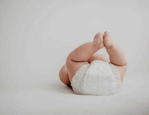 Baby laying on its back for diaper change