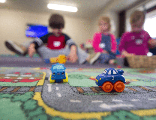 Children playing with toys on the floor