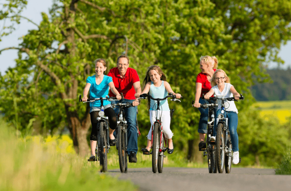 Family cycling together