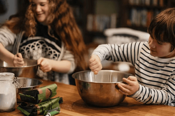 Mother and child mixing a bowl, engaged in a