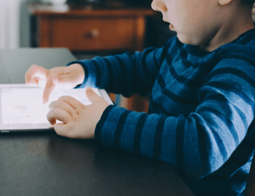 Young boy using a tablet, illustrating