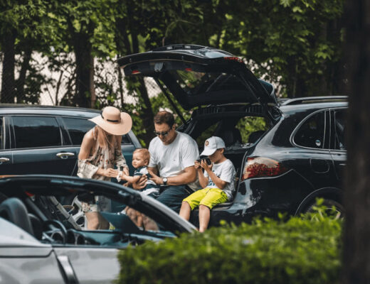 Group of people unsafely sitting in the trunk