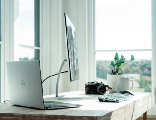 Laptop computer on a wooden desk in a home
