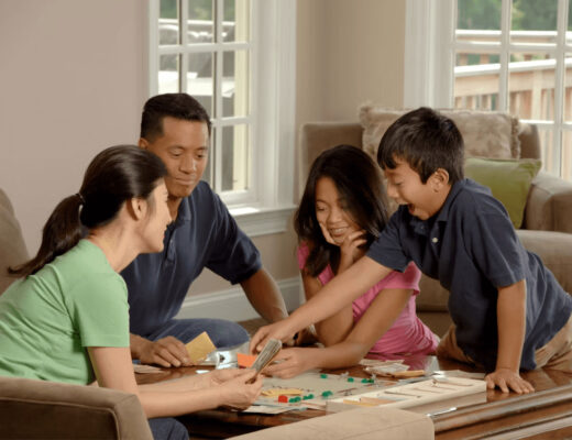 Multi-generational family playing a board