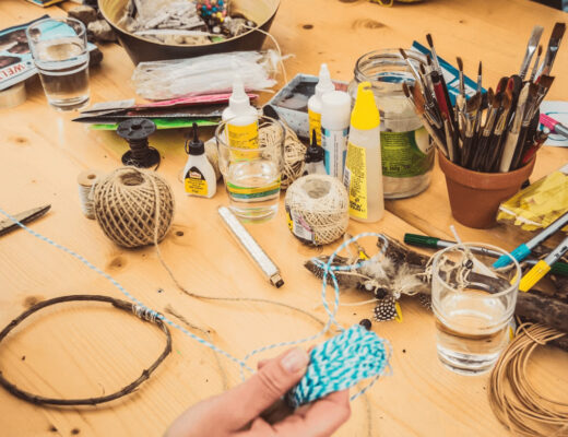 Wooden table with various crafting supplies