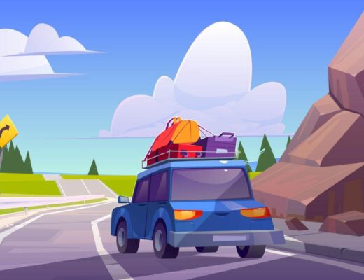 Car with luggage on roof driving on a road,