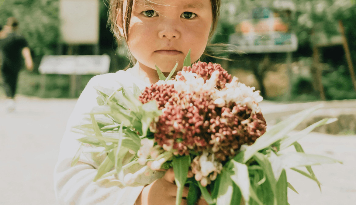 Child with Sympathy Flowers