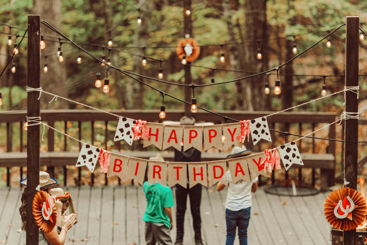 Group of people gathered on a wooden deck for a
