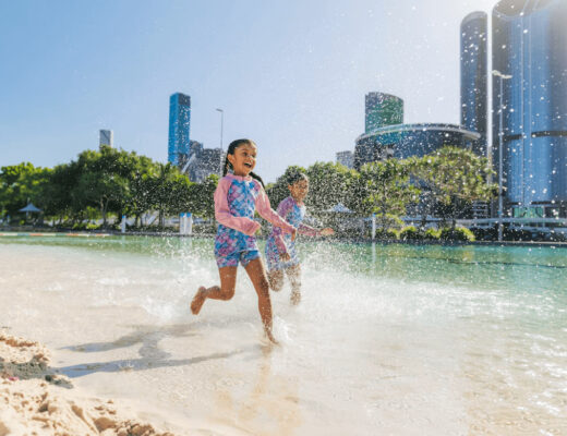 Kids playing in water during family holiday