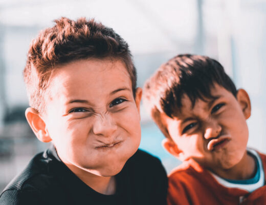 Two young boys standing together